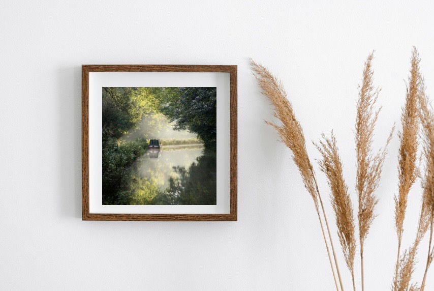 Framed art print in a modern living room setting