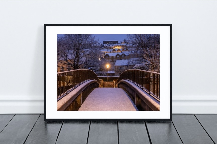 Framed art print in a modern living room setting