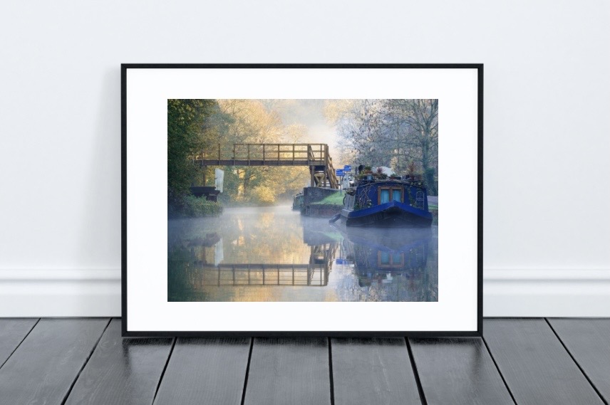 Framed art print in a modern living room setting