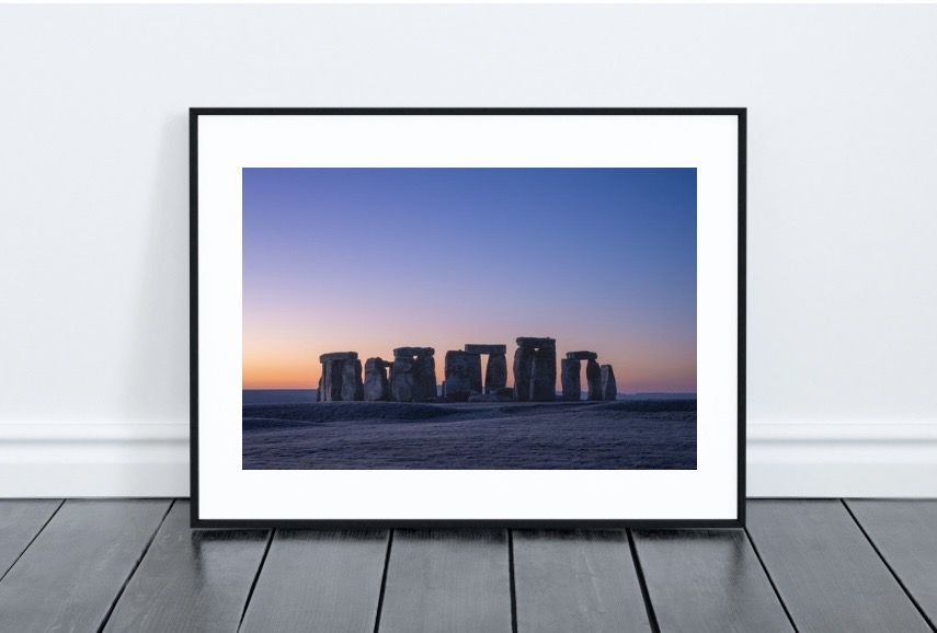 Framed art print in a modern living room setting